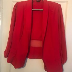 City chic red blazer with sheer sleeves